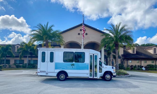 Facility transport vehicle in front of Palm Bay Memory Care