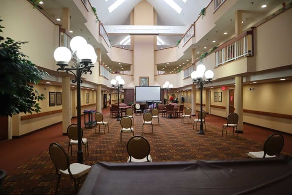 Spacious common area with chairs and decorative lighting