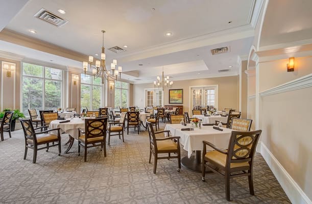 Elegant dining room with tables set for meals