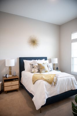 Elegant resident room with a cozy bed and decor