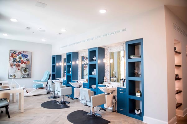 Salon space with styling stations and bright decor