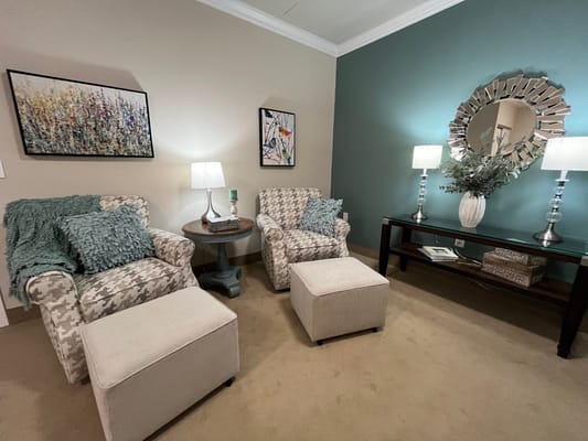 Cozy living room with patterned chairs and decorative elements