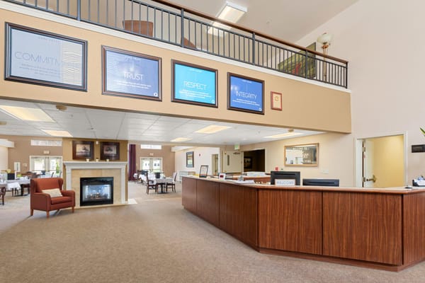 Bright lobby area with seating and signage