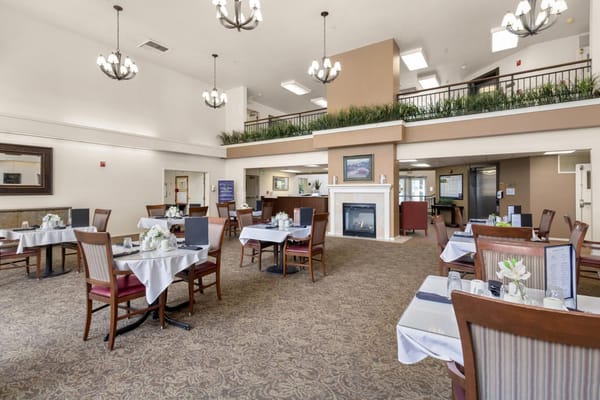 Interior dining area with tables and decorative flowers