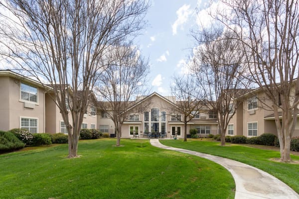 Well-maintained outdoor area with trees and pathways