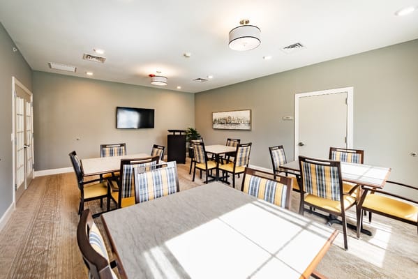 Bright dining area with tables and chairs