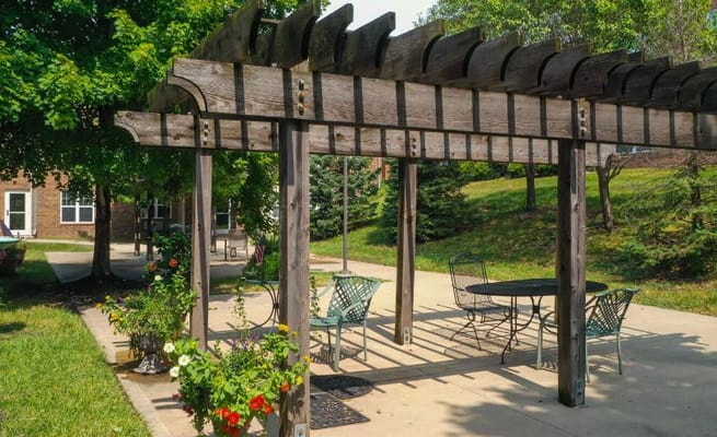 Outdoor seating area with pergola and planters