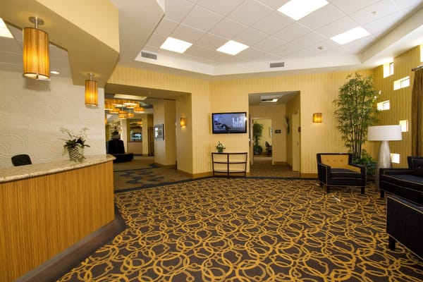 Welcoming reception area with seating and decorative lighting