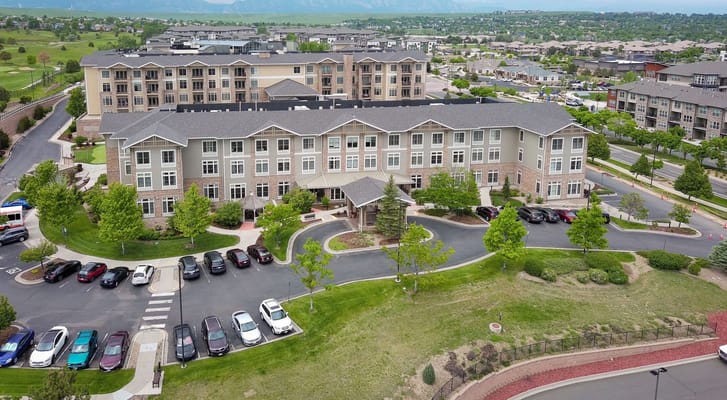 Aerial view of the exterior of Sunrise at FlatIrons senior living facility