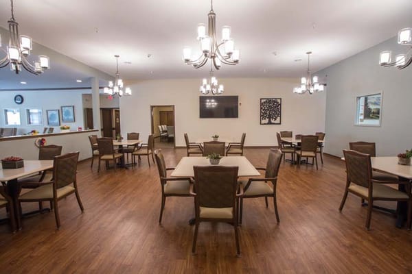 Dining room setup with tables and chairs