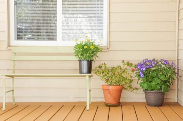 Front porch with flowers and seating area