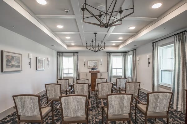 Empty meeting room with chairs arranged in rows