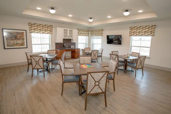 Bright and spacious common area with seating and kitchenette