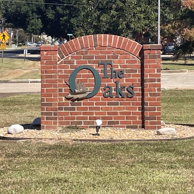 Brick sign of The Oaks Nursing & Rehabilitation