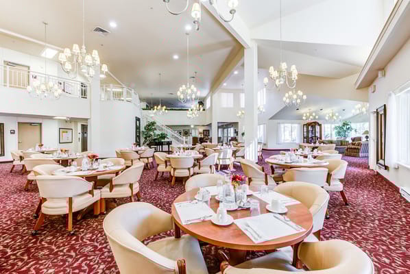Spacious dining area with tables and chairs set up for meals.