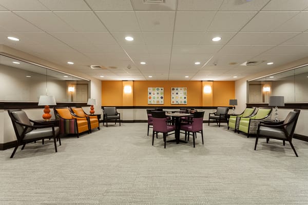 Lounge area with colorful seating and artwork