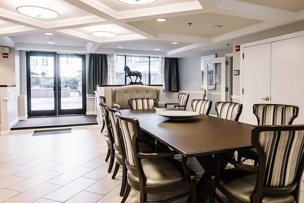 Common area with dining table and seating