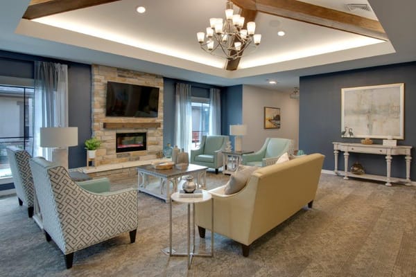 Cozy living room with seating and a fireplace