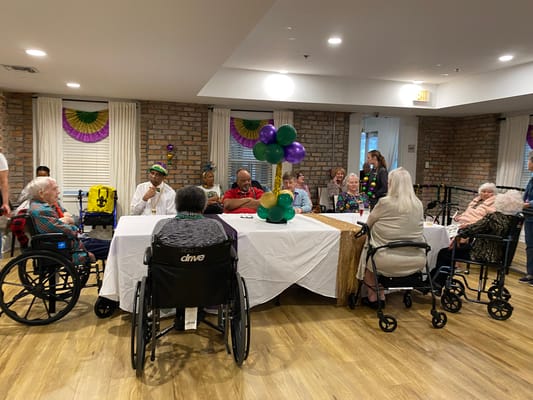 Residents participating in a festive gathering in the common area