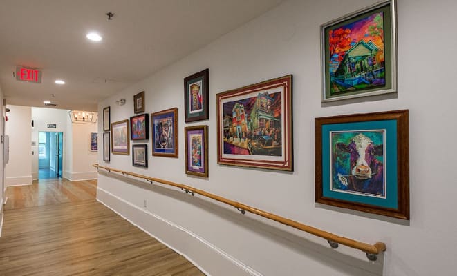 Colorful artwork displayed in a facility hallway