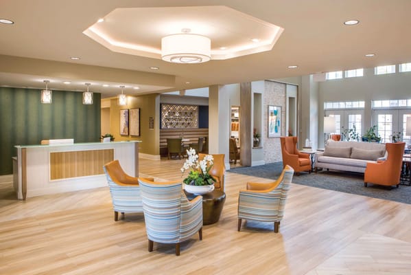 Bright and inviting lobby with seating and a reception desk