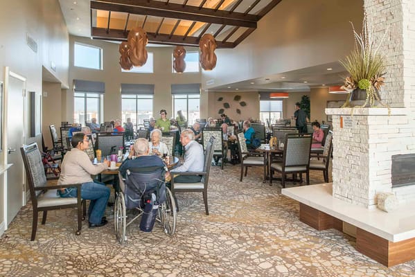 Residents enjoying a meal in a dining room