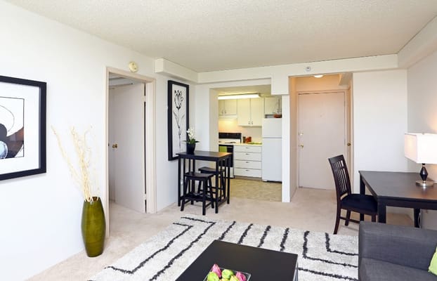 Bright living area with dining table and kitchen view