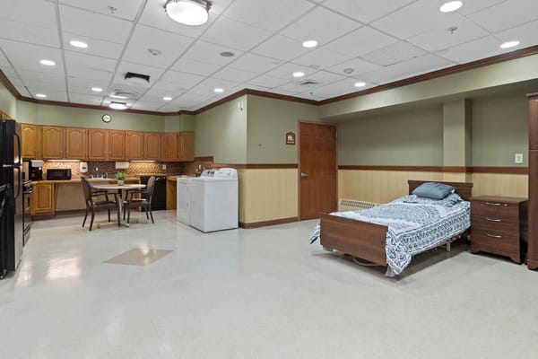Kitchen and bedroom space in a senior living facility