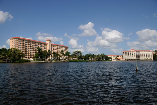 Exterior view of a senior living facility by the water
