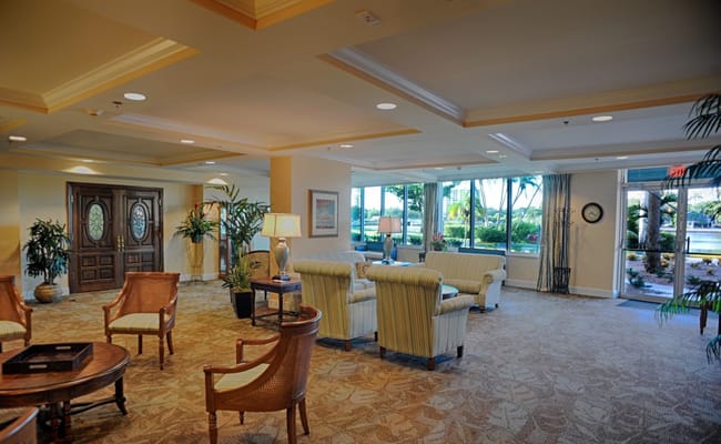 Bright common area with comfortable seating and plants