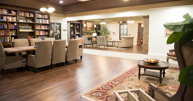 Spacious common area with seating and bookshelves