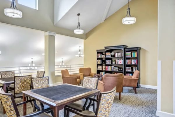 Bright common area with seating and bookshelves