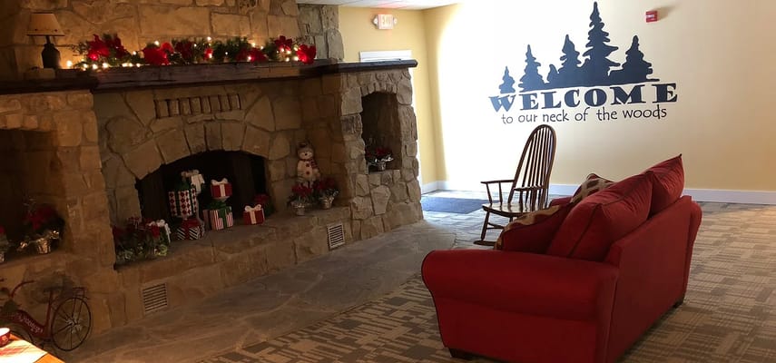 Cozy common area with fireplace and holiday decor