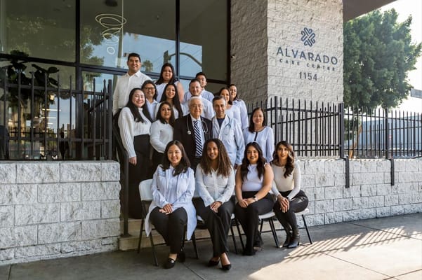 Staff posing outside Alvarado Care Center building