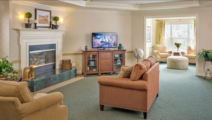 Common area with a fireplace and seating