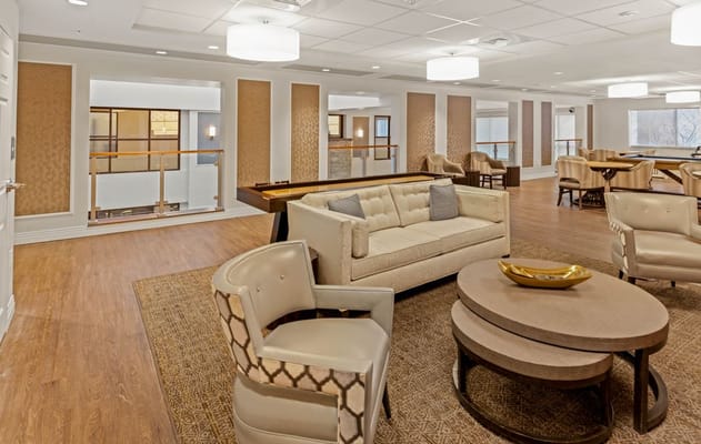 Bright interior lounge area with seating and decor