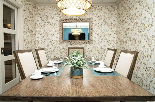 Spacious living room with comfortable seating and decorative shelves