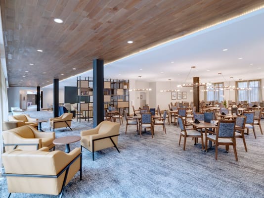 Cozy lounge area with seating and dining tables