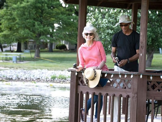 Residents enjoying fishing together by the water