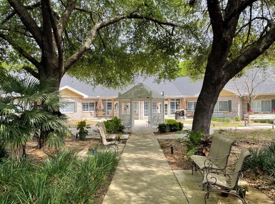 Pathway leading to a gazebo surrounded by trees
