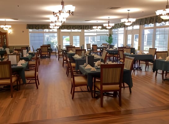 Well-set dining room with tables and chairs