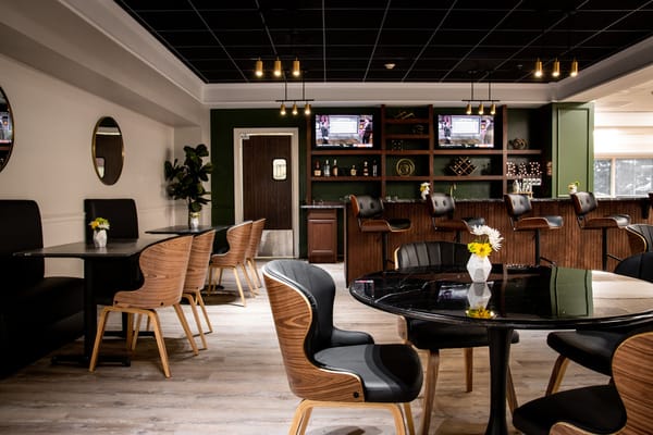 Common area with tables and chairs in a modern design