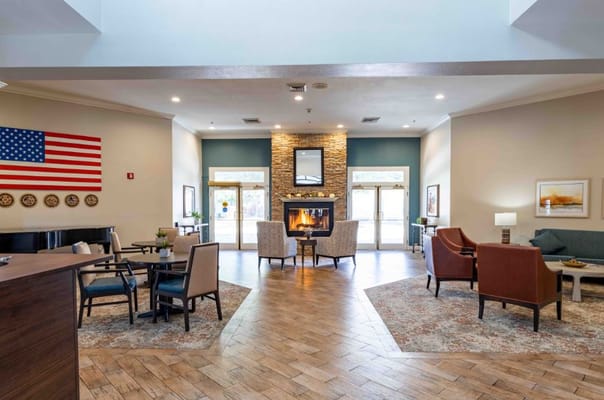 Interior view of a common area with seating and a fireplace