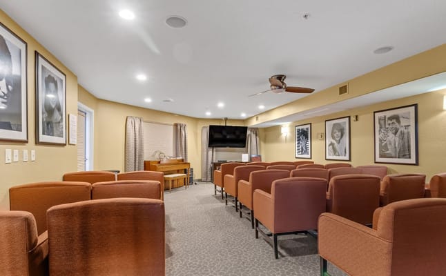 Common area with seating and TV for activities