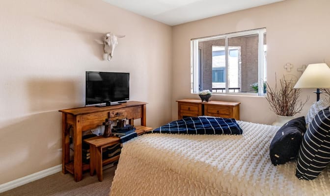 Cozy resident room with a bed and TV