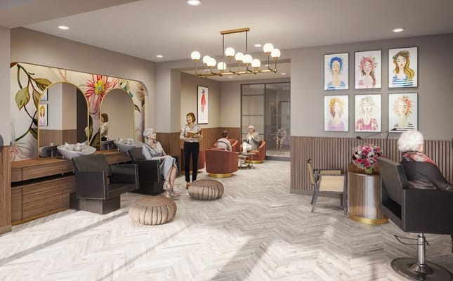 Interior view of the salon common area with residents and staff