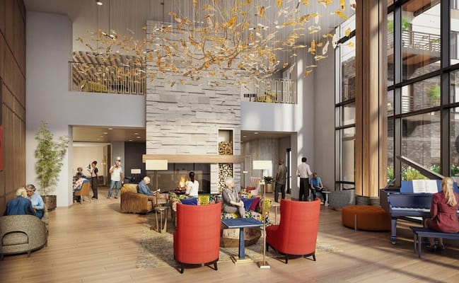 Spacious lobby with seating and a grand chandelier at The Reserve at Lone Tree