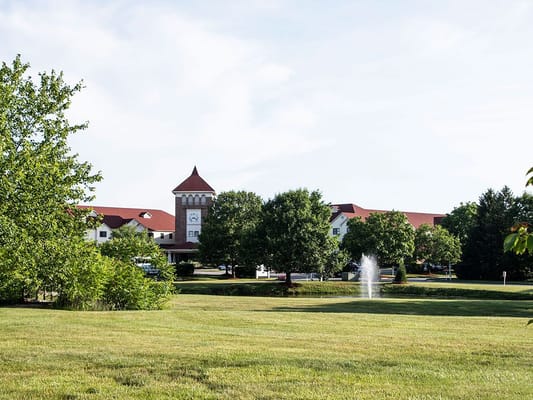 Exterior view of Robin Run Village Senior Living and surrounding landscape