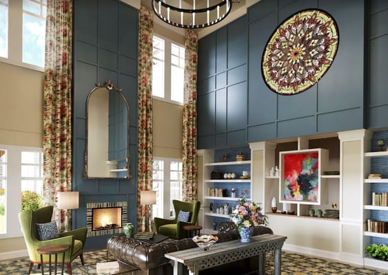 Bright common area with fireplace and seating