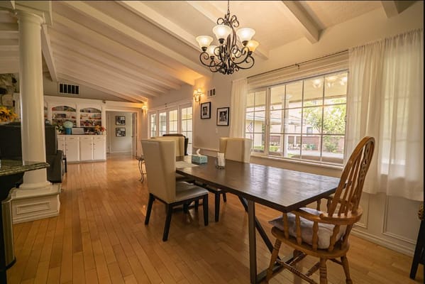 Bright dining area with wooden table and chairs